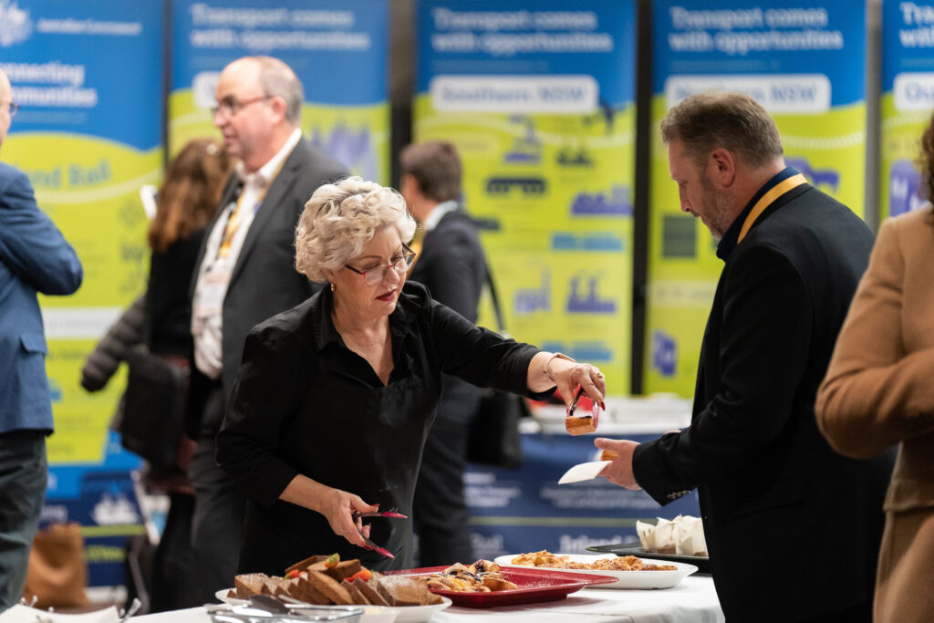 A business event delegate is served food