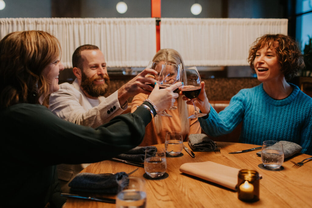 four people cheersing glasses at Yardbird